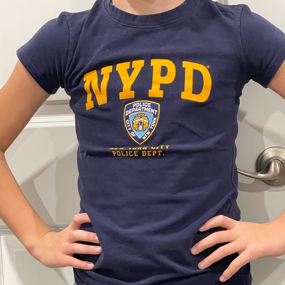 This M sized t-shirt for boys is a blue and yellow nypd shirt.